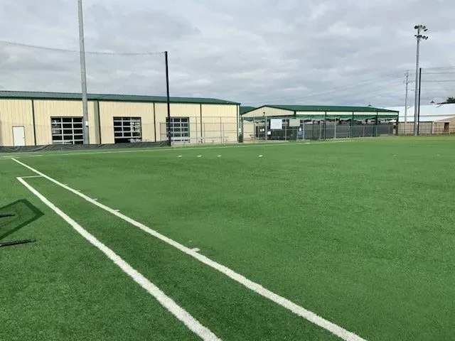 Outdoor turf field and facility buildings
