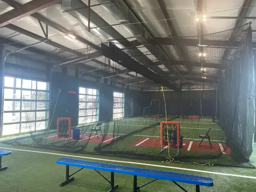 Cage tunnel and turf inside the team cage building